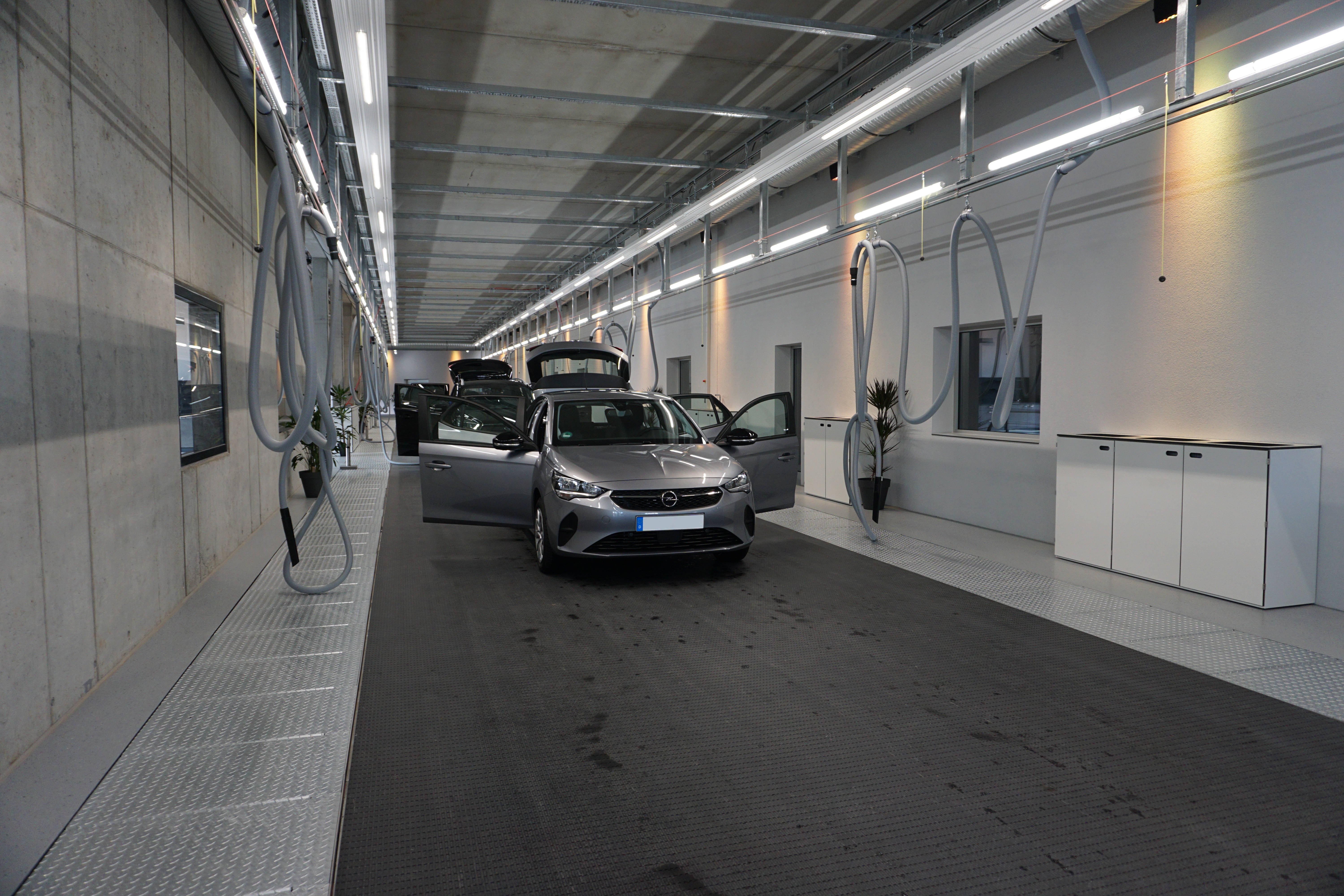2 cars on interior cleaning lines
